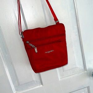 Baggallini vacation or daily crossbody organizer bag/ red
